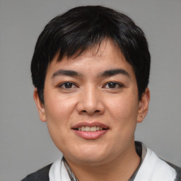 Joyful asian young-adult male with short  black hair and brown eyes