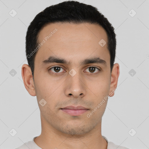 Neutral latino young-adult male with short  black hair and brown eyes