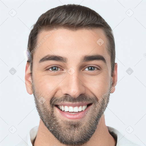 Joyful white young-adult male with short  black hair and brown eyes