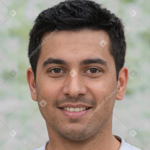 Joyful white young-adult male with short  black hair and brown eyes