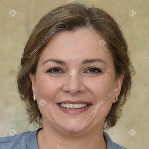 Joyful white adult female with medium  brown hair and brown eyes