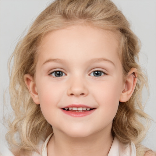 Joyful white child female with medium  brown hair and blue eyes