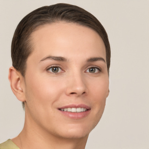 Joyful white young-adult female with short  brown hair and brown eyes