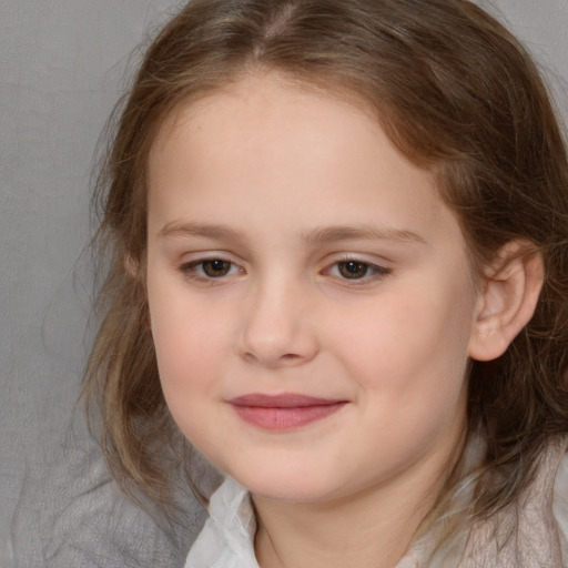 Joyful white child female with medium  brown hair and brown eyes