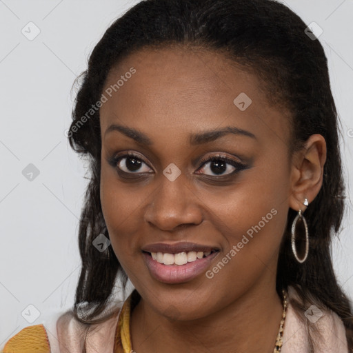 Joyful black young-adult female with long  brown hair and brown eyes