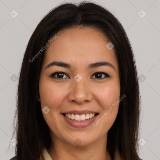 Joyful latino young-adult female with long  brown hair and brown eyes