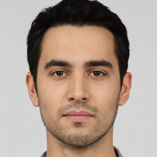 Neutral white young-adult male with short  black hair and brown eyes