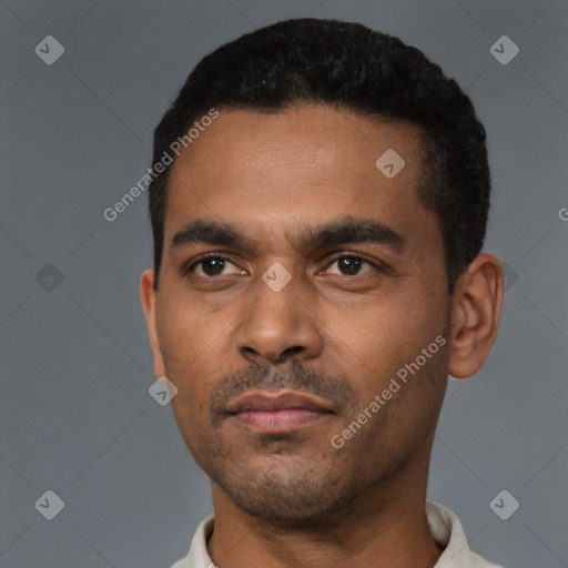 Neutral latino young-adult male with short  black hair and brown eyes