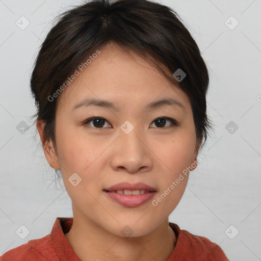 Joyful asian young-adult female with short  brown hair and brown eyes