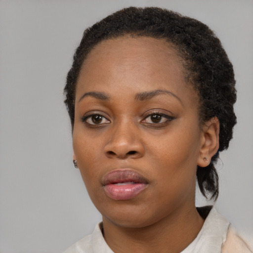 Neutral black young-adult female with short  brown hair and brown eyes