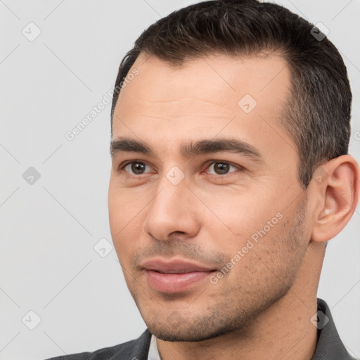 Joyful white young-adult male with short  brown hair and brown eyes