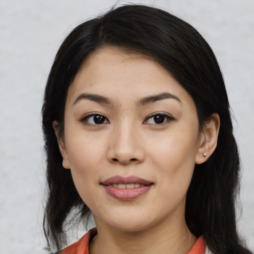 Joyful white young-adult female with medium  black hair and brown eyes
