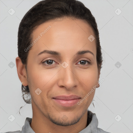 Joyful latino young-adult female with short  brown hair and brown eyes