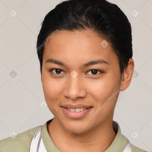 Joyful latino young-adult female with short  black hair and brown eyes