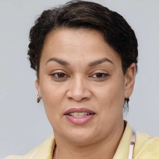 Joyful white adult female with short  brown hair and brown eyes