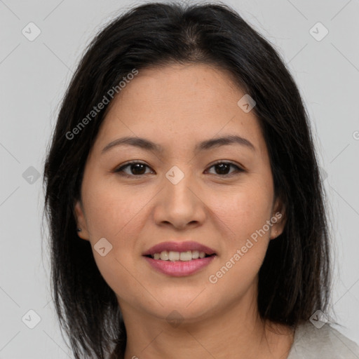 Joyful latino young-adult female with long  brown hair and brown eyes