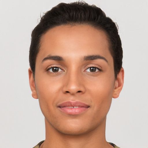 Joyful latino young-adult male with short  brown hair and brown eyes