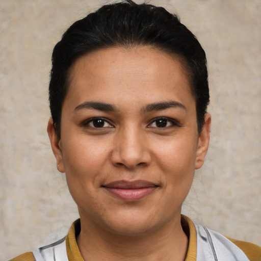 Joyful white young-adult female with short  black hair and brown eyes