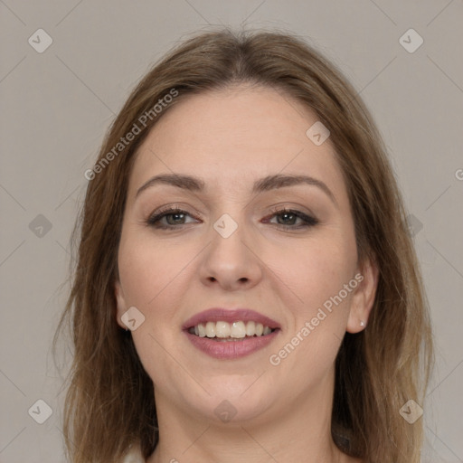 Joyful white young-adult female with long  brown hair and brown eyes