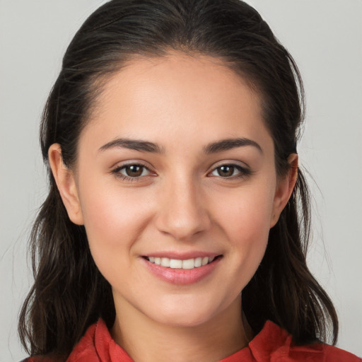 Joyful white young-adult female with long  brown hair and brown eyes