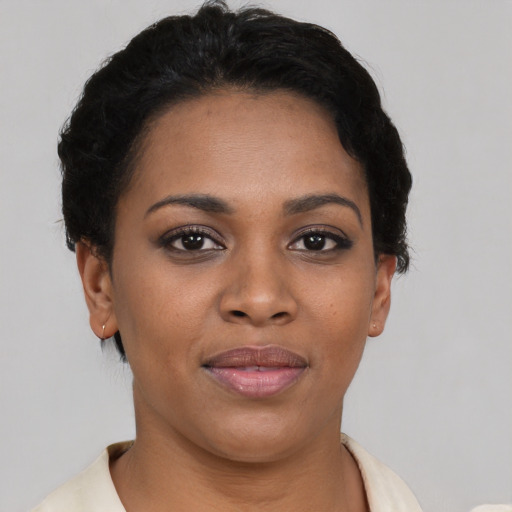 Joyful latino young-adult female with short  brown hair and brown eyes