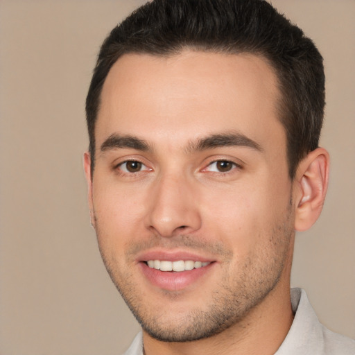 Joyful white young-adult male with short  brown hair and brown eyes