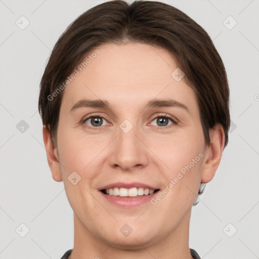 Joyful white young-adult female with short  brown hair and grey eyes