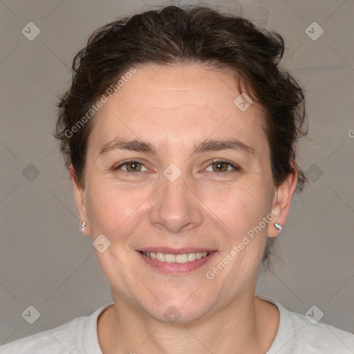 Joyful white adult female with short  brown hair and brown eyes