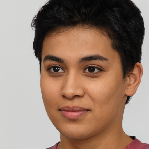 Joyful asian young-adult female with short  brown hair and brown eyes