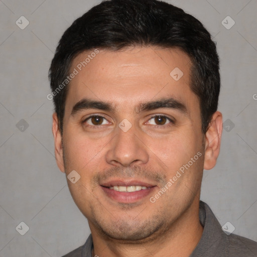 Joyful white young-adult male with short  black hair and brown eyes