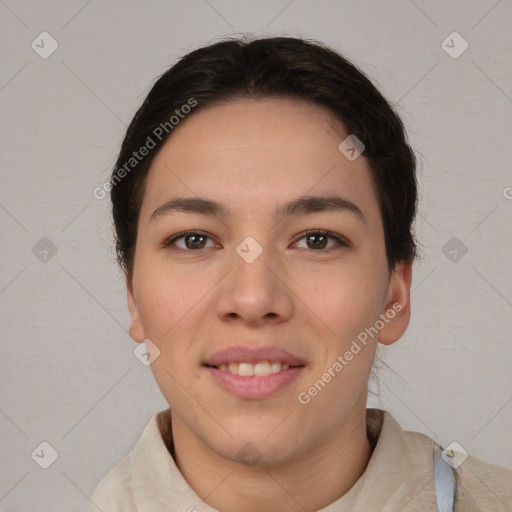 Joyful asian young-adult female with short  brown hair and brown eyes