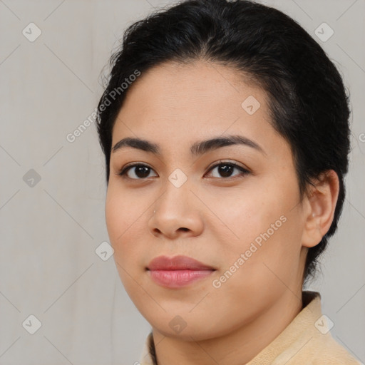 Joyful latino young-adult female with medium  brown hair and brown eyes