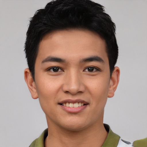 Joyful asian young-adult male with short  black hair and brown eyes