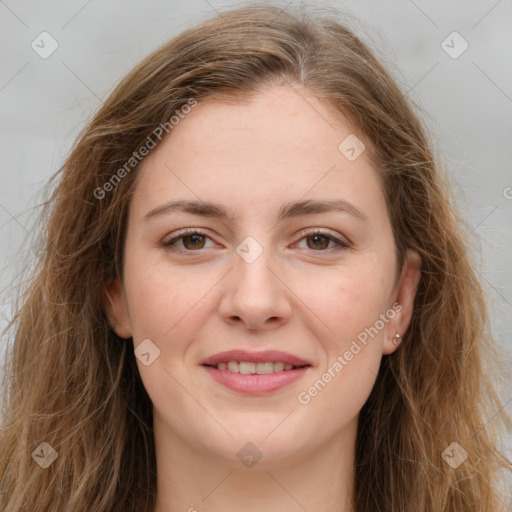 Joyful white young-adult female with long  brown hair and green eyes