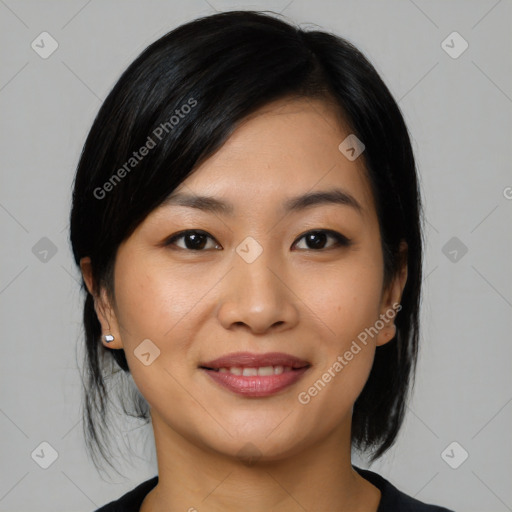 Joyful asian young-adult female with medium  black hair and brown eyes