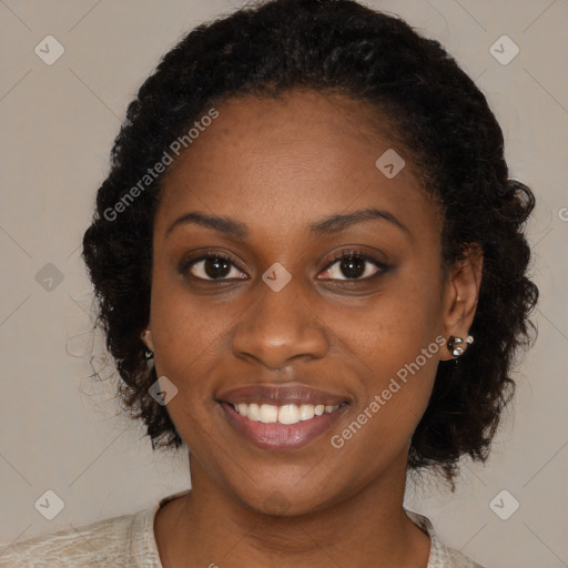 Joyful black young-adult female with long  brown hair and brown eyes