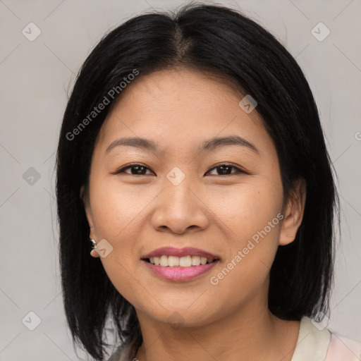 Joyful asian young-adult female with medium  black hair and brown eyes