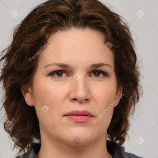 Joyful white young-adult female with medium  brown hair and green eyes