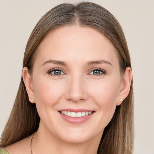 Joyful white young-adult female with medium  brown hair and blue eyes