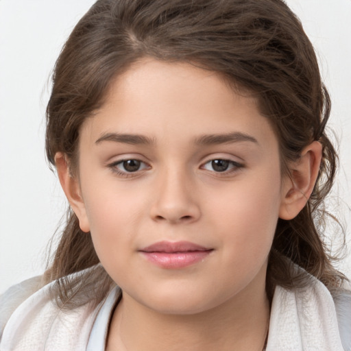 Joyful white child female with long  brown hair and brown eyes