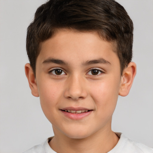 Joyful white child male with short  brown hair and brown eyes