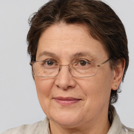 Joyful white middle-aged female with medium  brown hair and brown eyes