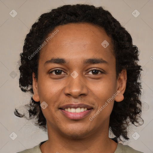 Joyful black young-adult male with short  black hair and brown eyes