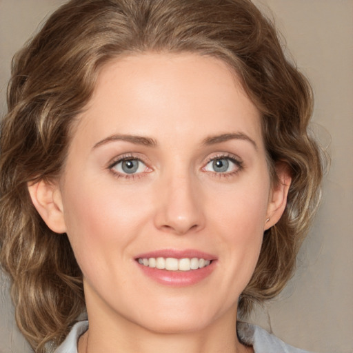 Joyful white young-adult female with medium  brown hair and green eyes