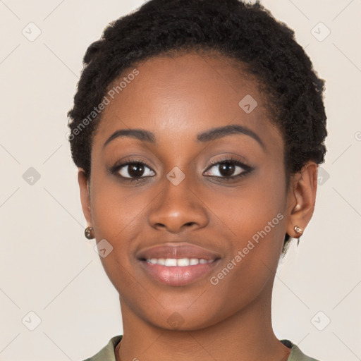 Joyful black young-adult female with short  brown hair and brown eyes