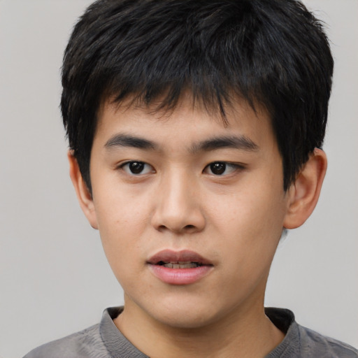 Neutral asian child male with short  black hair and brown eyes