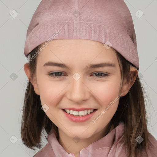 Joyful white child female with medium  brown hair and grey eyes