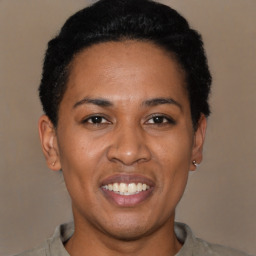 Joyful latino young-adult female with short  black hair and brown eyes