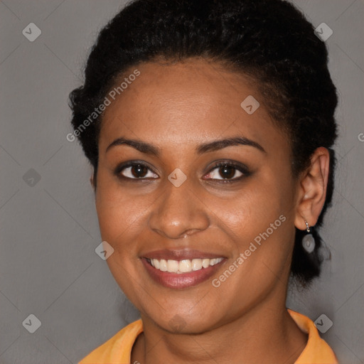 Joyful black young-adult female with short  brown hair and brown eyes