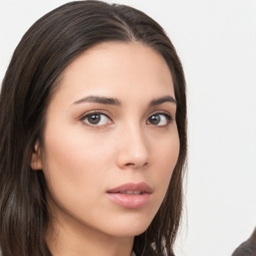 Neutral white young-adult female with long  brown hair and brown eyes